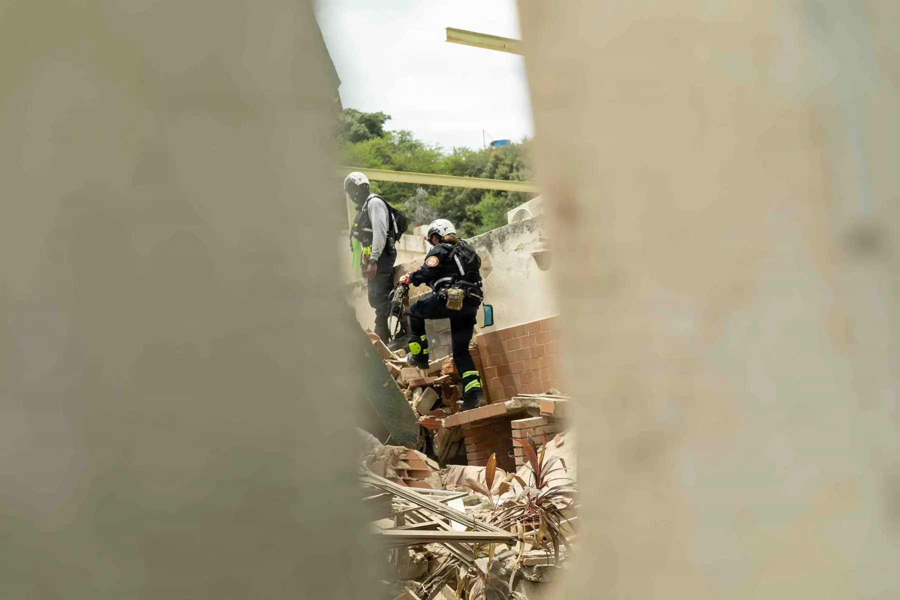 Urban search and rescue teams searching damaged buildings in La Guaira